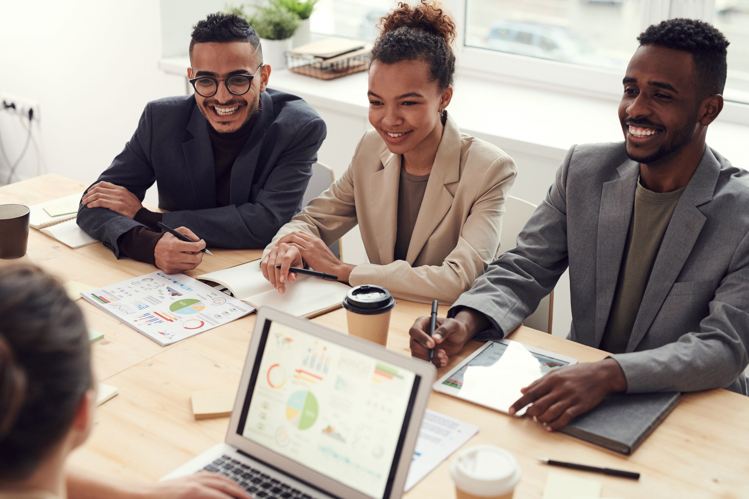 Coworkers laughing at meeting